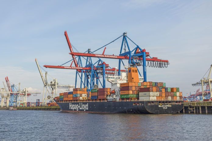 ship of Hapag Lloyd is loaded with huge cranes in harbor of Hamburg Hapag Lloyd Containerschiff