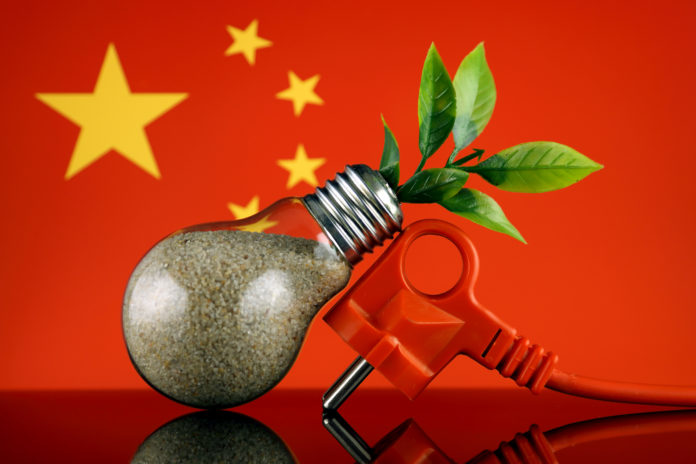 AdobeStock_promesaartstudio-238267605-Plug-plant-growing-inside-the-light-bulb-and-China-Flag-Green-eco-renewable-energy-concept