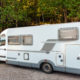 Camping van microbus parked in summer forest